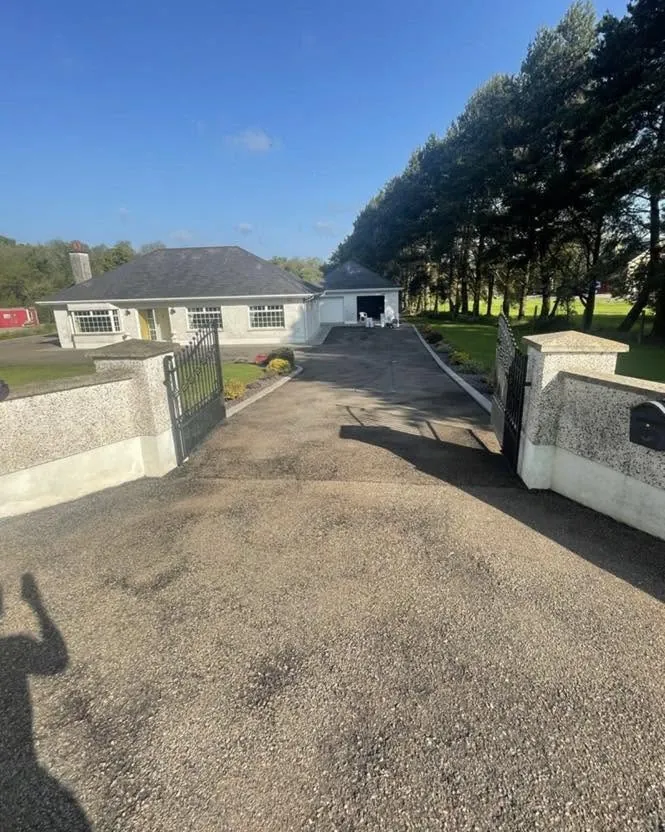Worn driveway before cleaning and sealing, Flaherty Roof and Driveways